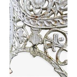 Pair of ornate painted cast iron bench ends, painted in white finish