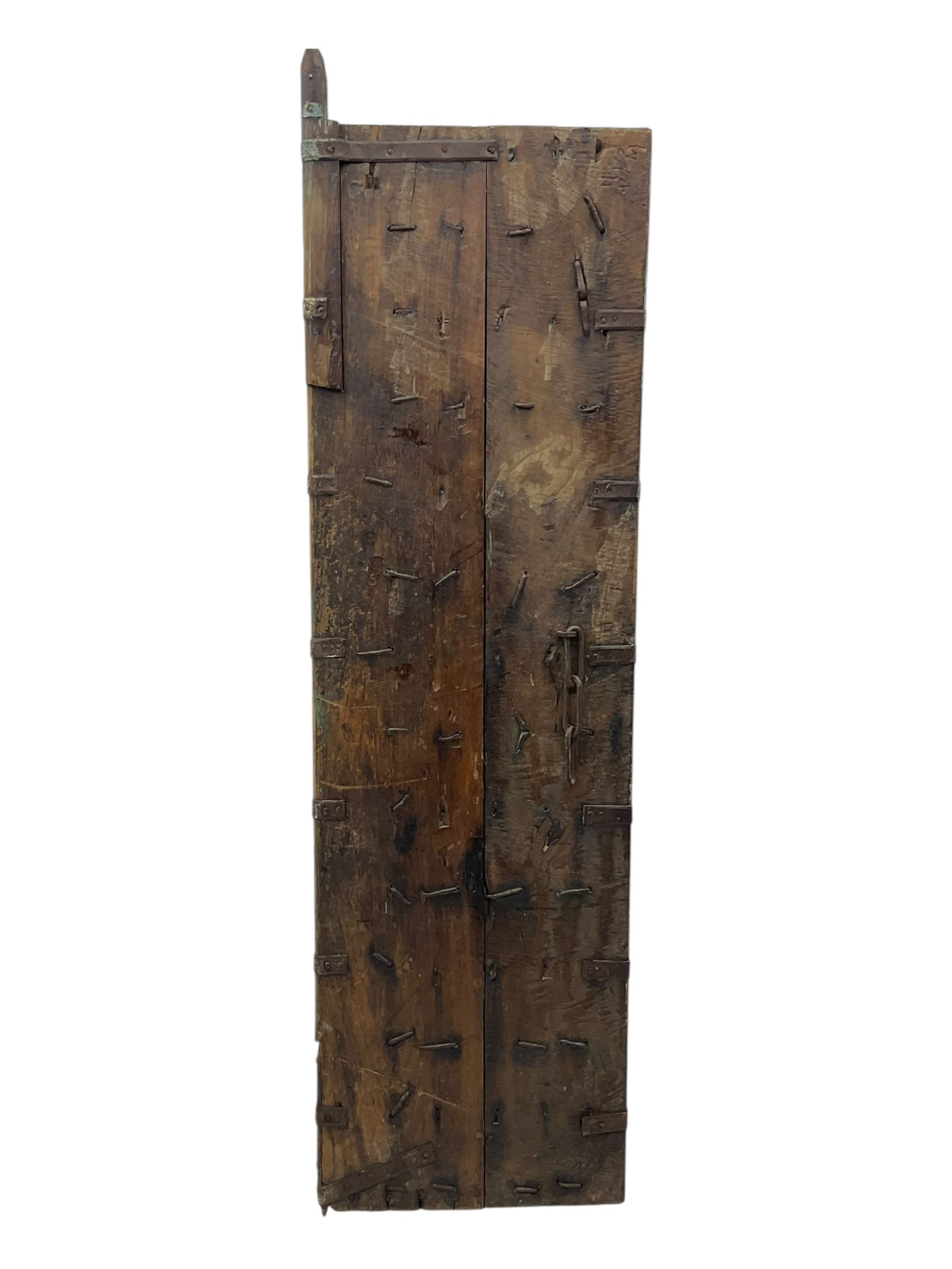 Pair of green-painted Indian doors, c.1860–1880, made from solid teak featuring original iron work and hand-painted finish