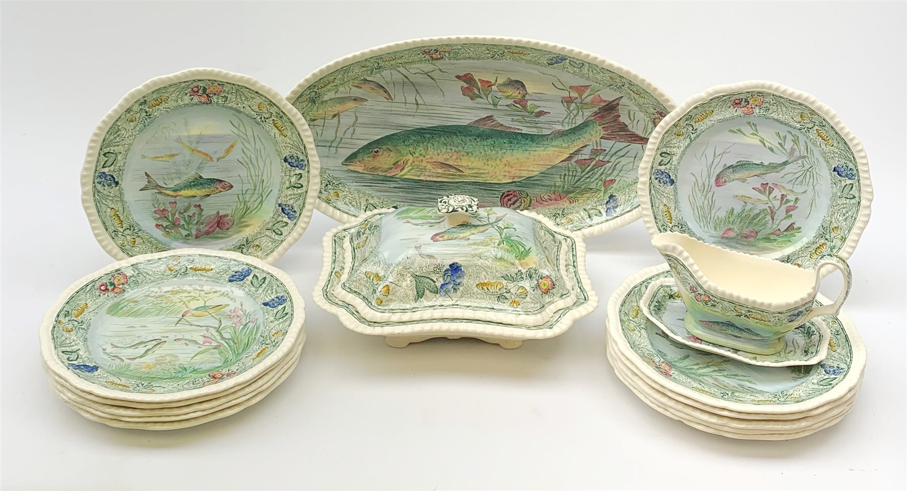 A Copeland Spode fish service, comprising twelve plates, oval serving platter, tureen and cover and sauce jug and stand, platter L46.5cm.