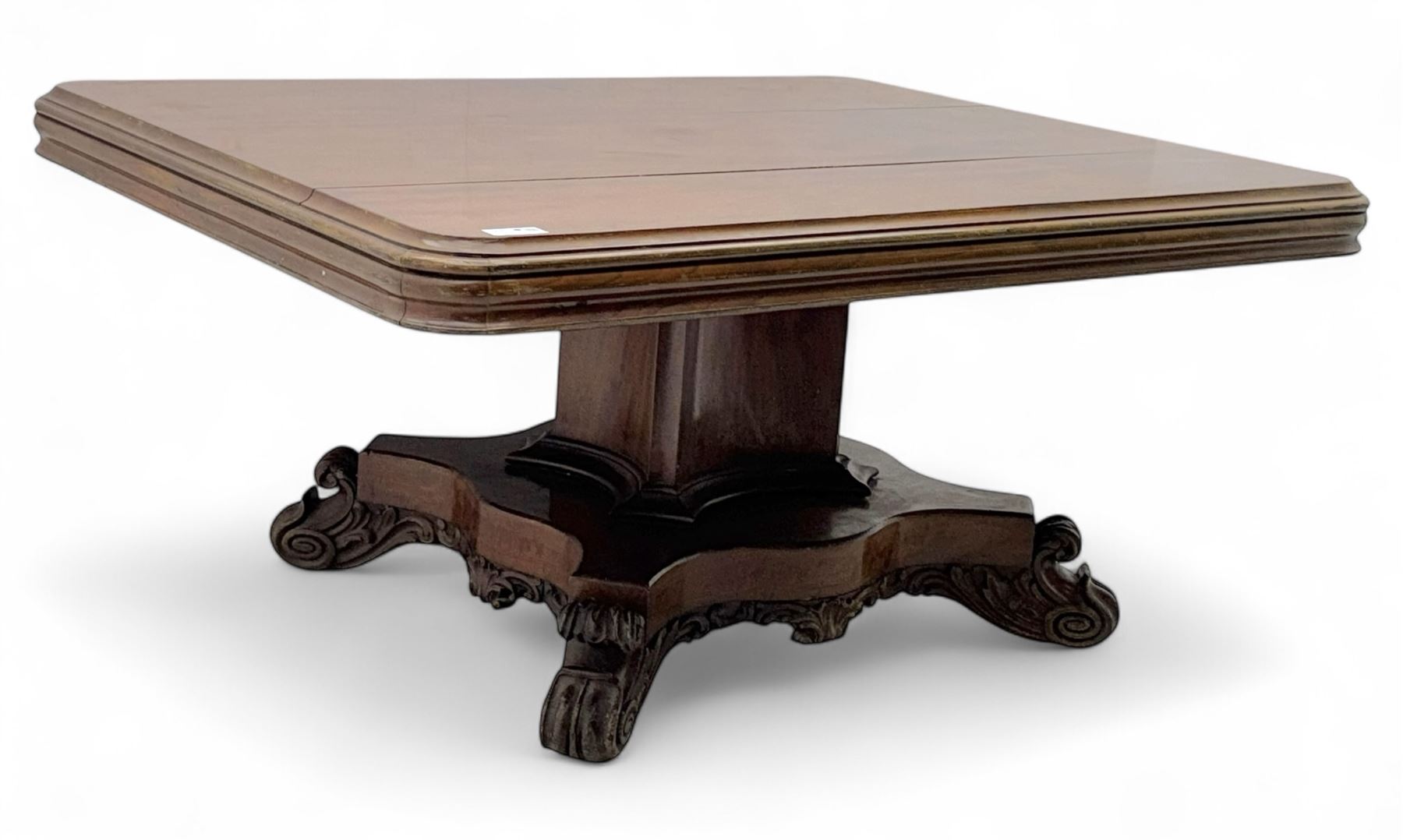 Victorian mahogany tilt-top table dining table, rounded tilt rectangular top with moulded edge, on octagonal column, raised on shaped quadriform base with bold scrolled feet