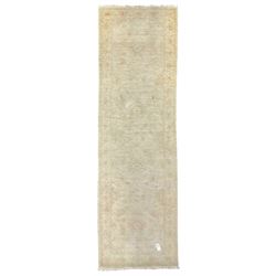 Persian Zeigler runner, ivory ground decorated with faint floral design 