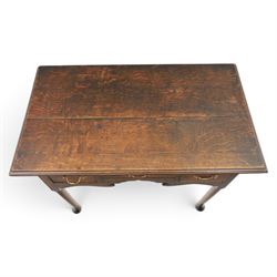 18th century oak lowboy, rectangular plank top with moulded edge, above three assorted drawers with brass swan neck handles, shaped apron raised on pad feet