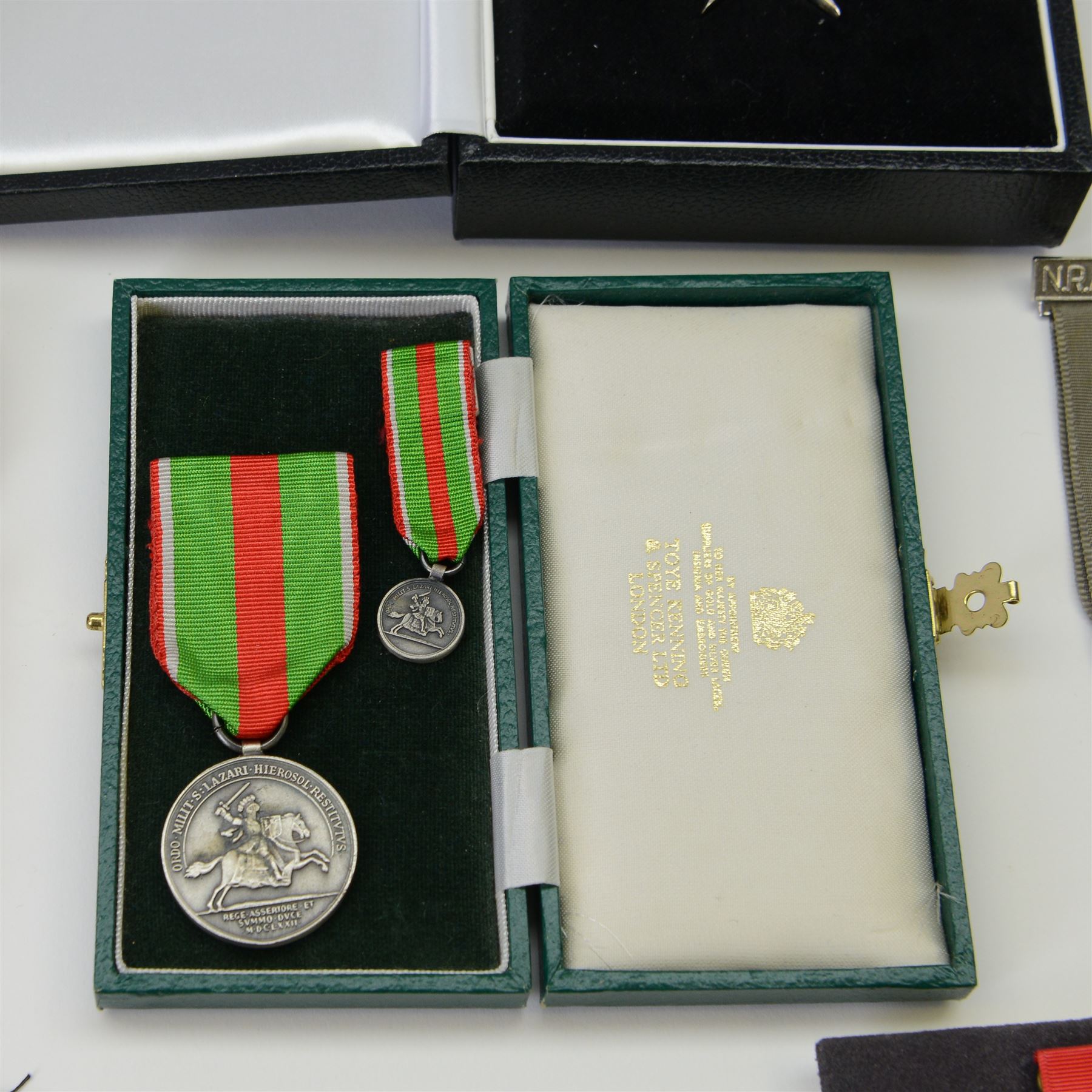 Collection of medals, insignias and minitures, including American National Defence medals, Efficiency Decoration medal, Order of St. John of Jerusalem stars, Military and Hospitaller Order of St. Lazarus of Jerusalem medals etc, several by Toye, Kedding & Spencer Ltd and Worcestershire Medal Service Ltd
