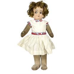 1920s Chad Valley 'Bambina' doll, the pressed felt head with applied hair, side glancing inset glass eyes, painted facial features and velvet jointed body, Hygenic and Bambina labels to the feet H46cm