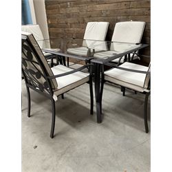 Metal framed garden table with glazed top (W170cm, D102cm, H71cm) and six armchairs with cushions 