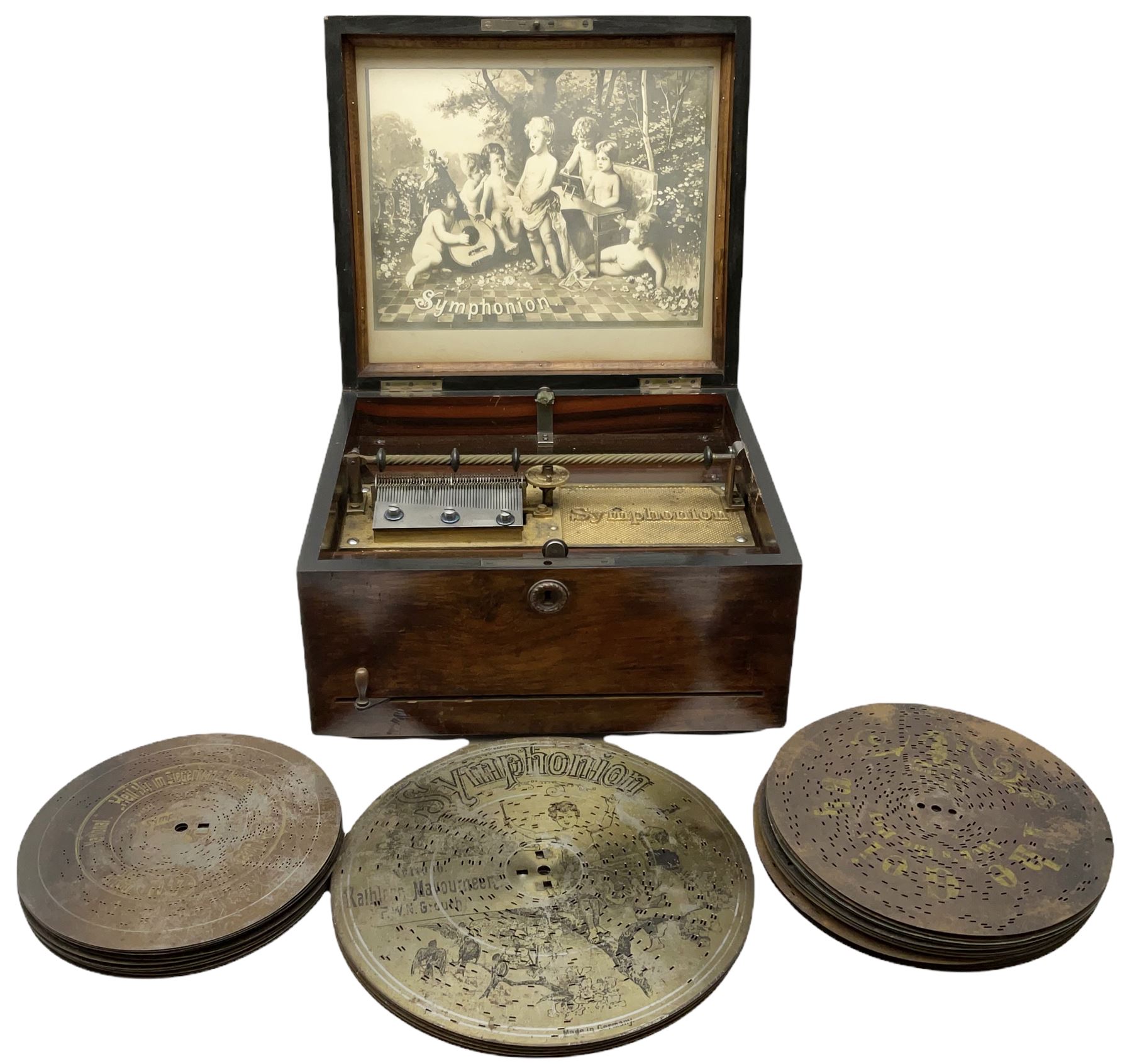 Late 19th century Symphonion disc musical box in inlaid walnut case with front lever action playing 25.5cm discs on a 10.5cm steel comb with forty-nine teeth, musical scene of cherubs under the lid, L33cm; together with five 25.5cm discs, fifteen 20.5cm discs and eleven 19cm discs