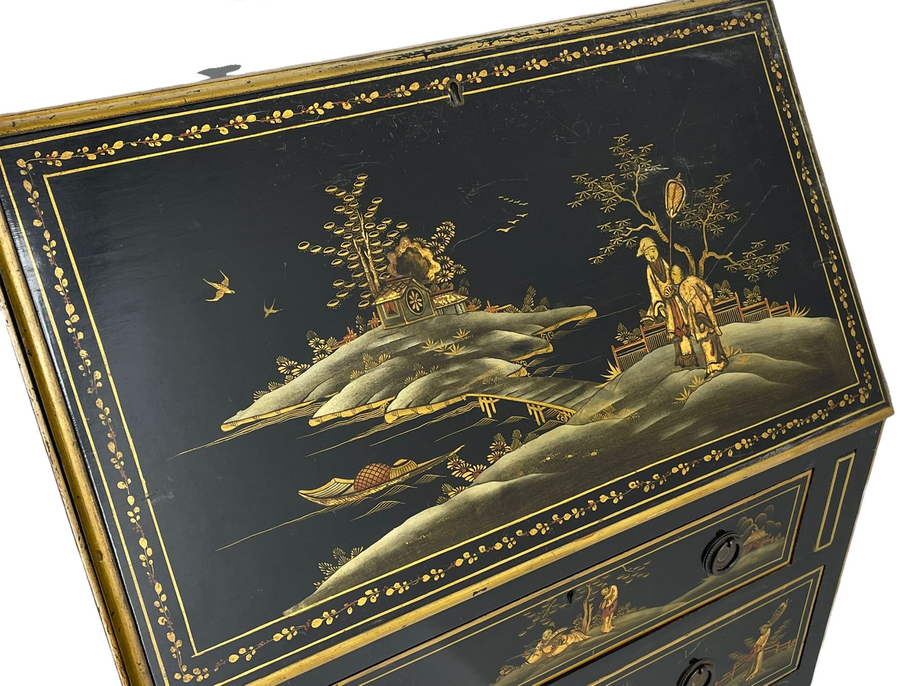 Early 20th century Chinoiserie lacquered bureau, raised gilt decoration, fall front enclosing divisions and drawer, three graduating long drawers, on cabriole supports