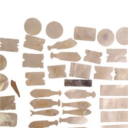 Collection of approximately sixty mother-of-pearl gaming tokens, including fish-shaped, rectangular, circular examples 