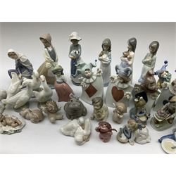 Collection of Nao figures, including four playing card jesters, two clowns, Virgin Mary and baby Jesus , five geese etc. 