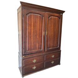 George III oak press cupboard, dentil cornice over two arch fielded panel doors, the base fitted with four drawers with pressed brass handle plates