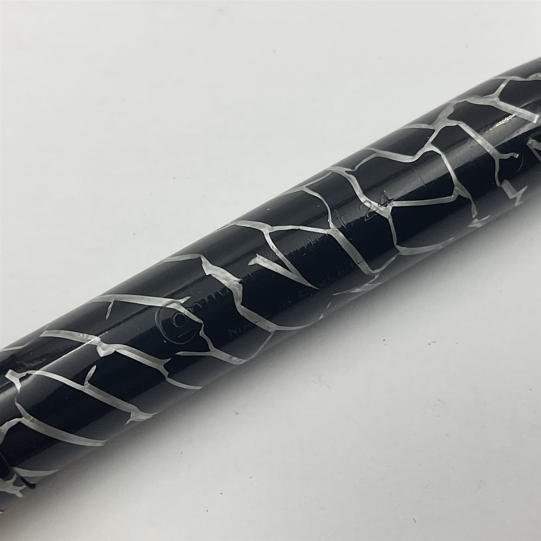 Three Conway Stewart fountain pens, comprising Cracked Ice 28 pen, the black and pearl white barrel engraved Conway Stewart 28 and double banded cap, with gold nib stamped 14ct, together with a Conway Stewart 75 lever fill pen, the green marble barrel and cap with single band and gold nib stamped 14ct and Conway Stewart 55 lever fill fountain pen with black barrel and cap with single broad band and two narrow bands with gold nib stamped Duro 14ct, largest L13cm