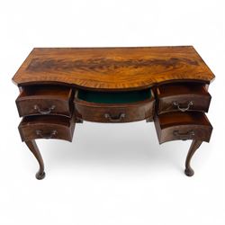 20th century figured walnut serpentine dressing table, moulded top with book-matched veneers over an arrangement of five drawers fitted with brass swan neck handles, on cabriole supports with shell carved knees
