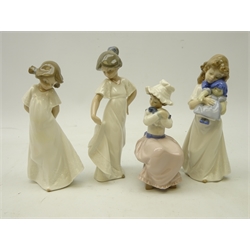  Four Nao figurines two girls in white dresses, a girl holding a puppy and a girl carrying a doll (4)  