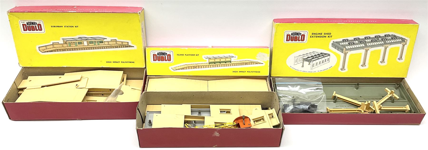 Hornby Dublo - 5006 Engine Shed Extension Kit; 5085 Suburban Station Kit with instructions; and 5030 Island Platform Kit; all in pictorial boxes; and Goods Depot Moulded Kit in box base only (4)