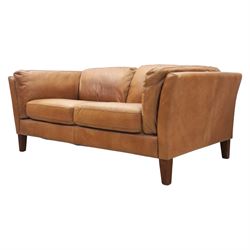 Two seat sofa upholstered in tan leather