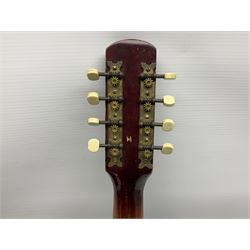 Dulcet eight-string banjo mandolin with mother-of-pearl inlaid ebonised fingerboard L55.5cm; cased; and Irish mahogany bodhran hand drum with inlaid stringing and vellum top D46.5cm; in soft carrying case with double ended beater (2)