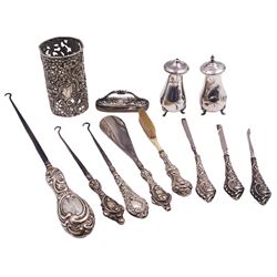 Group of silver, comprising two Victorian silver handled button hooks, hallmarked Birmingham 1900, and an Edwardian example, hallmarked Birmingham 1904, various makers marks, five further silver handled tools of similar date, an Edwardian silver mounted buffer, a Victorian foliate pierced sleeve, hallmarked Henry Matthews, Birmingham 1900, and pair of 1930's cruets, hallmarked Barker Brothers Silver Ltd, Birmingham 1935, approximate weighable silver 3.50 ozt (109 grams)