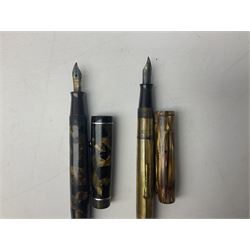Two fountain pens with stamped 14ct gold nibs comprising a Waterman's example and Stephen's example, Bewlay pipe and another similar, 'Siglo XX Japan' desk clock in case, table lighters, rulers and other misc in one box