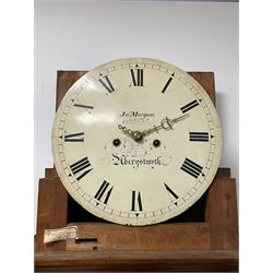 John Morgan of Aberystwyth - fine George IV mahogany 8-day longcase clock c1820, with a raised swan necked pediment, ball and eagle finial and deep inlaid frieze beneath, square hood door with a glazed circular wooden bezel and canted corners, long trunk with reeded quarter columns and a wavy topped door, rectangular plinth on bracket feet, circular painted dial with Roman numerals, minute track, makers name, and brass stamped hands, rack striking four pillar movement with a recoil anchor escapement, striking the hours on a bell. With weights and pendulum. 
John Morgan is recorded as working in Aberystwyth 1816-35. 