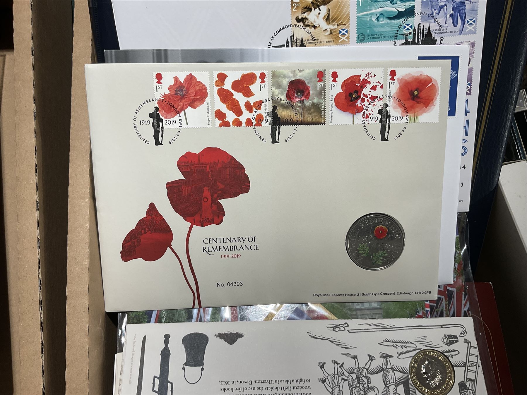 Approximately one hundred and fifteen Royal Mint coin covers, in two ring binder folders and loose, together with approximately 53 grams of Great British pre-1920 and approximately 68 grams of Great British pre-1947 silver threepence coins, and a small quantity of further pre-decimal coins