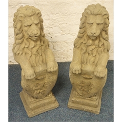  Pair stone effect seated lions, holding crested shield, stepped plinth base, H81cm  