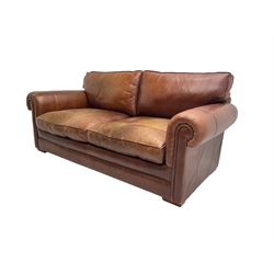Large two seat sofa upholstered in tan 'Derwent' leather (W200cm D100cm H85cm), and matching armchair (W95cm)