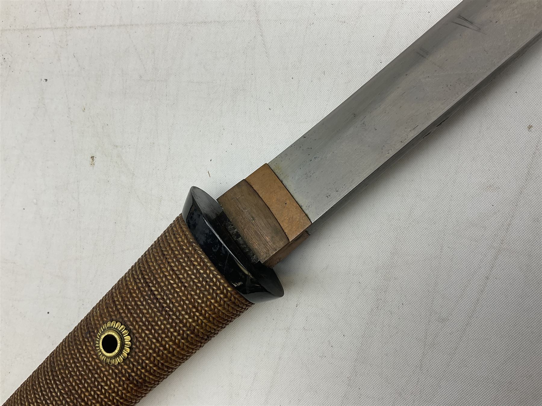 Japanese Tanto with 28.5cm steel blade and cord bound grip; in red spotted black lacquer saya containing a kogai knife with etched characters to the blade and ornate fern leaf and snake handle