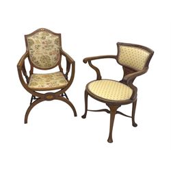 Edwardian inlaid mahogany X-frame armchair, upholstered seat and shield-back, curved front supports united by turned H-stretcher (W57cm, D58cm, H94cm); similar inlaid mahogany armchair, raised on cabriole supports united by cross-stretcher (W62cm, D60cm, H82cm) 