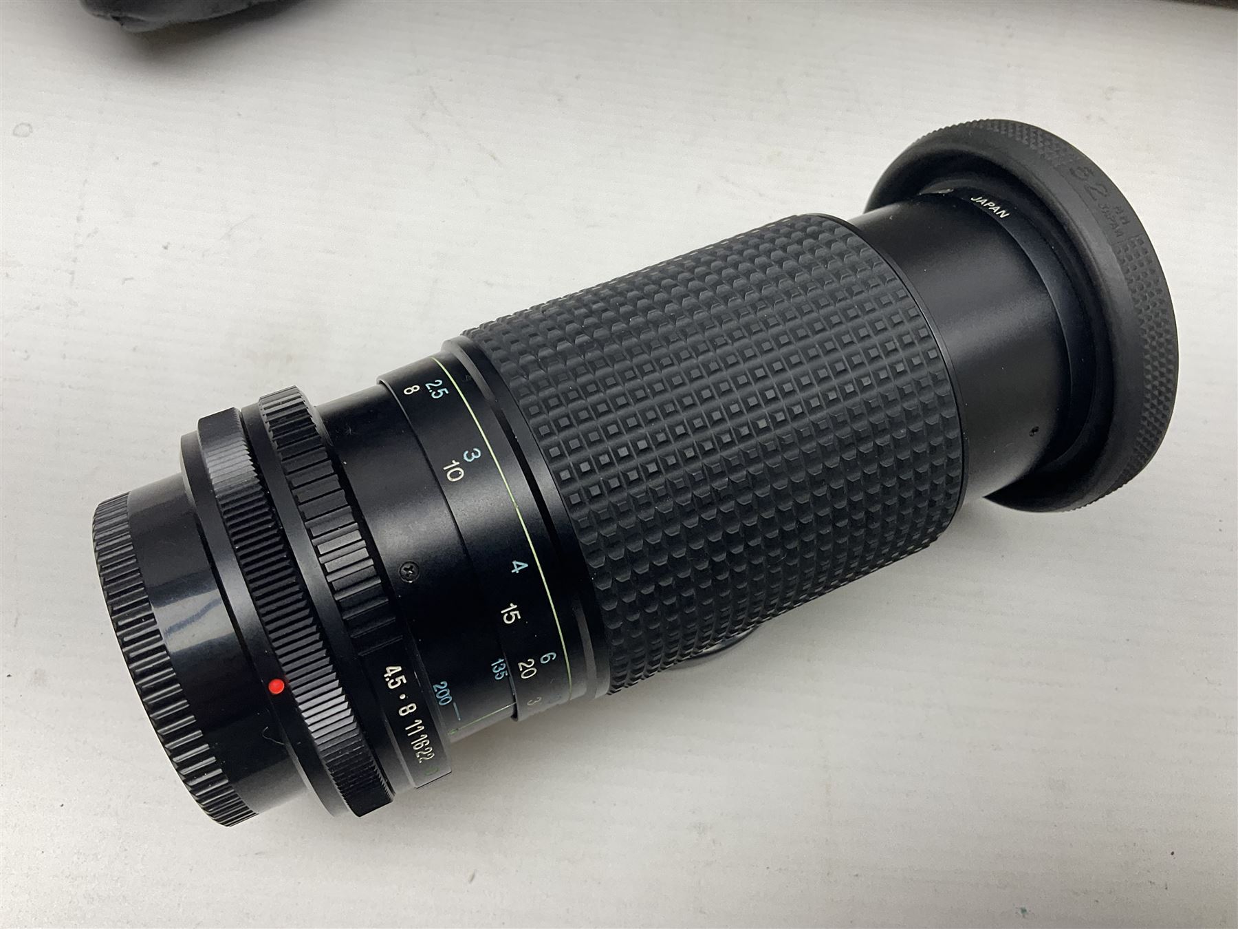 Canon A1 35mm camera body serial no 741264, with 'Tokina AT-X 28-85mm 1:3.5-4.5' lens serial no 821679, 'Canon FD 50mm 1:1.8mm' lens and other camera equipment 