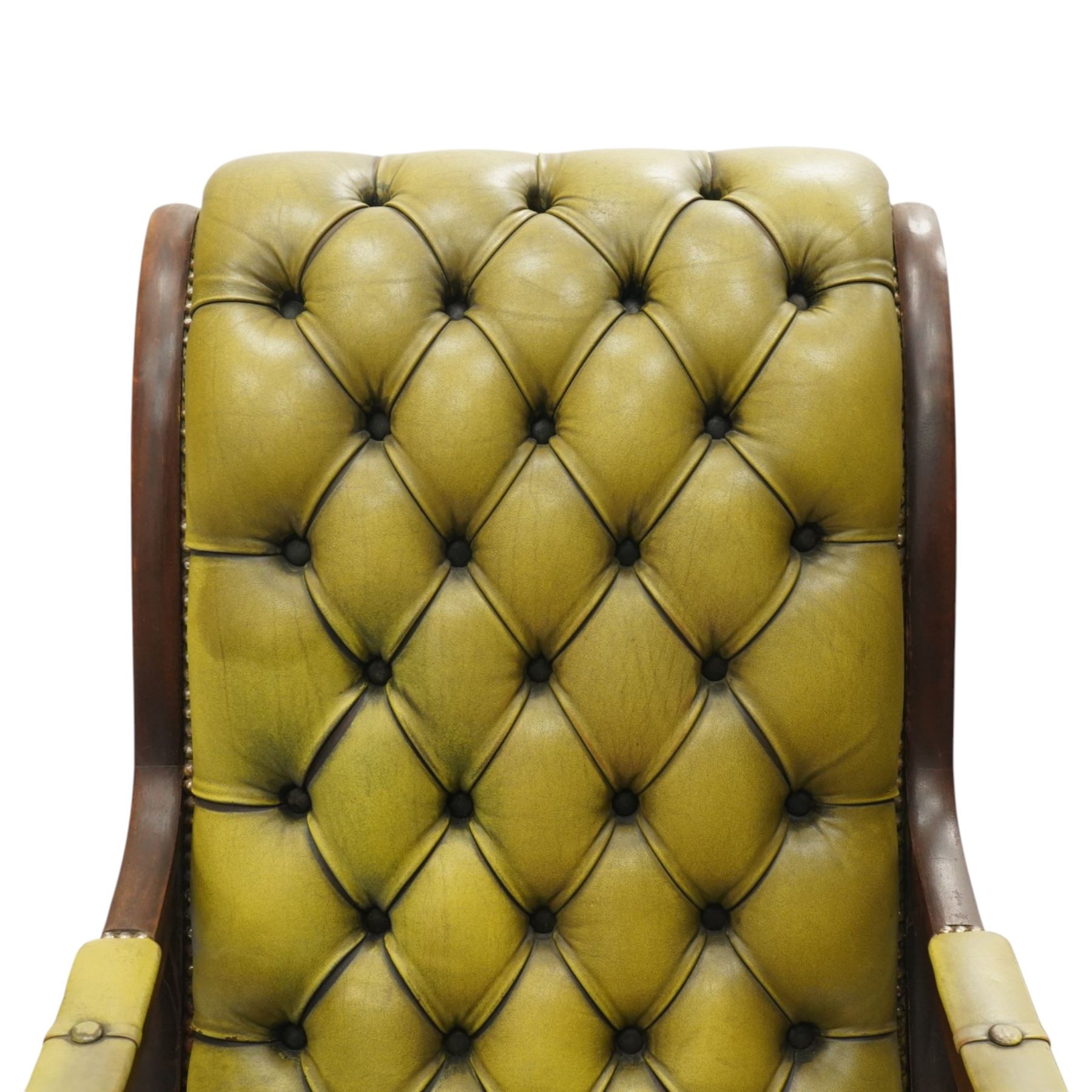 Regency design slipper chair upholstered in buttoned green leather, down swept arms with padded sections, swept back and shaped frames