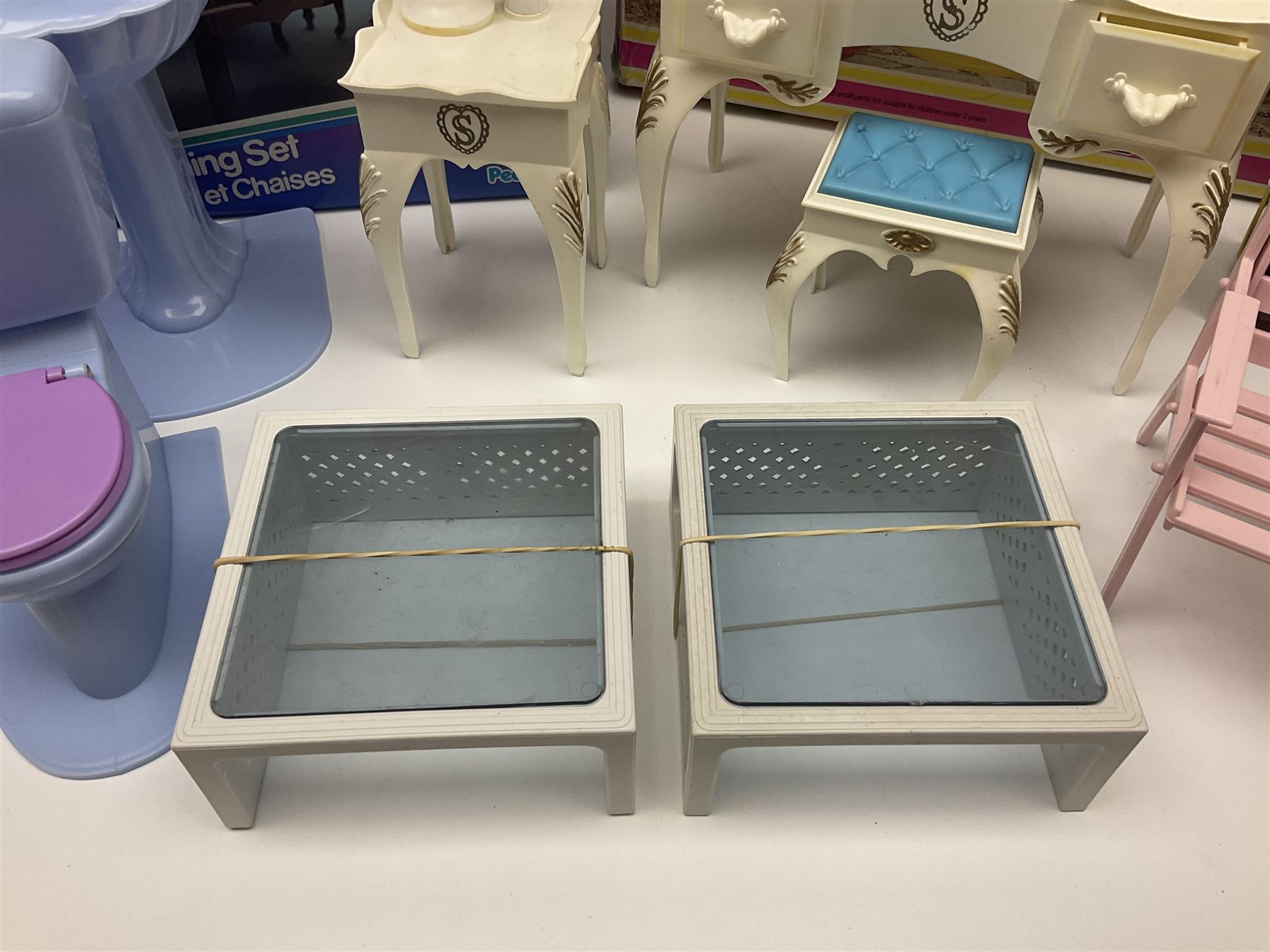 Sindy - furniture and accessories comprising dining suite with separate dresser; two beds; Garden Set; Music Centre; all  boxed; three-piece bedroom suite; settee; Hostess Trolley; two coffee tables; and four-piece bathroom suite including shower cubicle