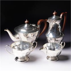 Silver three piece tea set of panelled circular form Birmingham 1929 Maker Synyer & Beddoes and a similar hot water jug Sheffield 1954 