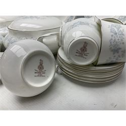 Royal Doulton tea and dinner wares in the Meadow Mist pattern, no H5007, comprising seven dinner plates, eight side plates, two lidded tureens, two jugs, lidded sucrier, oval serving dish, six teacups, seven saucers, seven tea plates and large saucer
