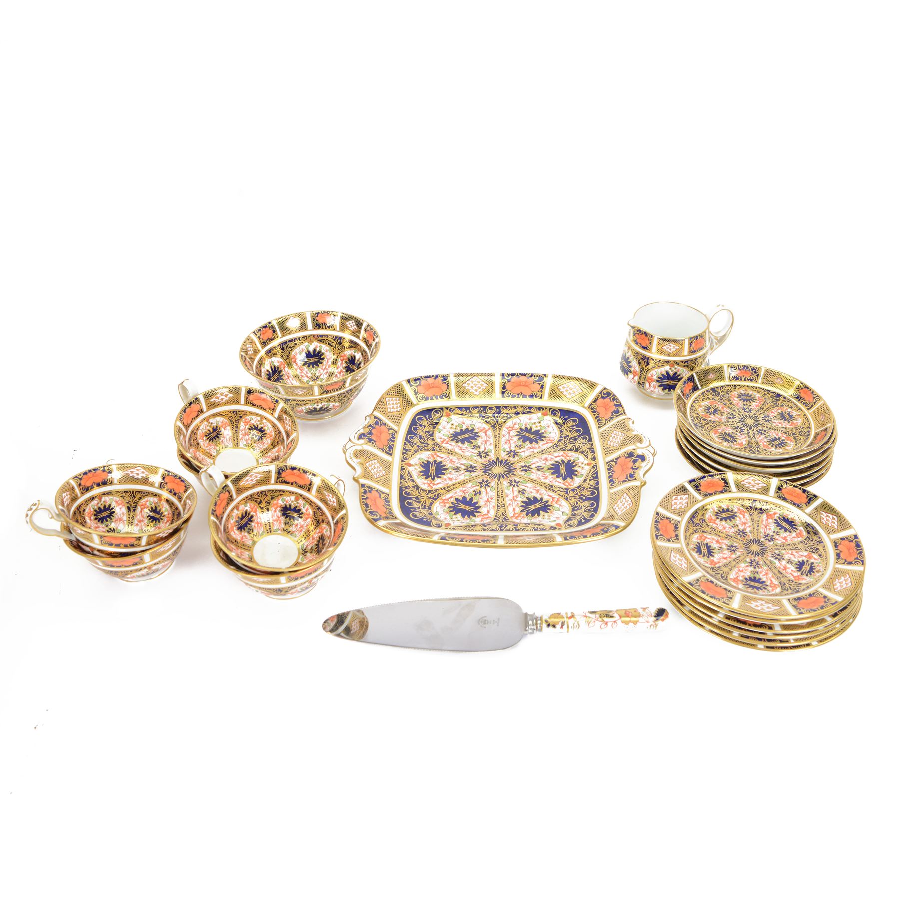 Royal Crown Derby tea service for six in Imari 1128 pattern, comprising teacups and saucers, side plates, sandwich plate, milk jug, open sucrier and cake slice 