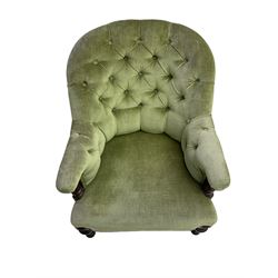 Victorian mahogany framed armchair, upholstered in buttoned sage green fabric with sprung seat, raised on turned and fluted front supports with matching arm terminal column supports