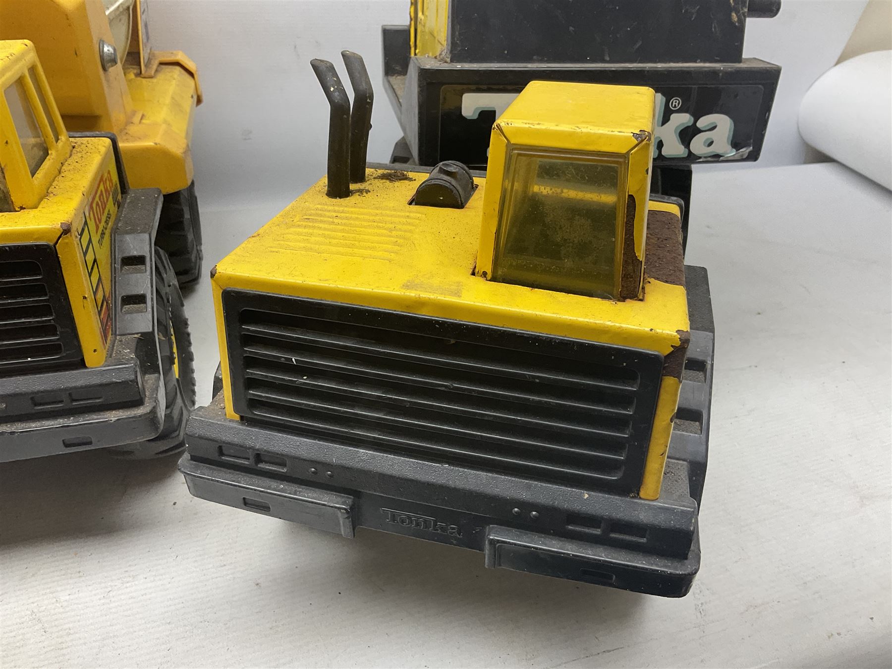 Tonka - five large scale pressed steel vehicles comprising Cement Mixer, Mighty Mobile Crane, Jeep and two Dumper Trucks (5)