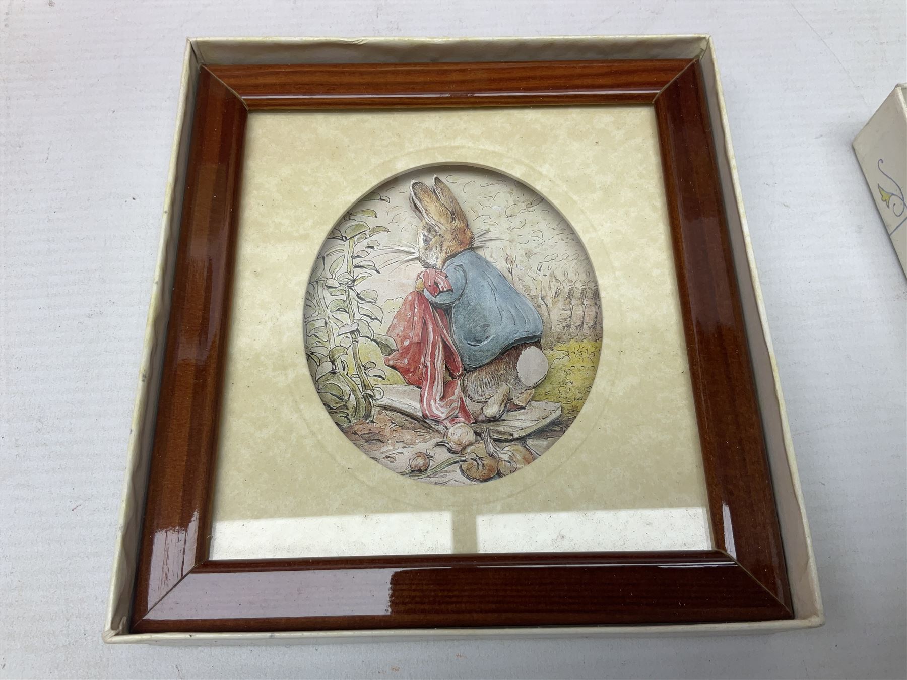 Royal Doulton The Mickey Mouse Collection Pluto figure, Coalport Characters The Snowman Dressing Up figure, three Royal Doulton Bunnykins figures comprising Policeman, Morris Danger and Eskimo, and display stand, Royal Doulton John Beswick Tiggy Winkle, Royal Albert Beatrix Potter Peter Postbag and three Goebel Hummel figures, all boxed