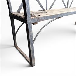 19th century and later Estate made wrought iron strapwork garden bench, the weathered wooden cresting rail over X-form strapwork back and slatted wooden seat