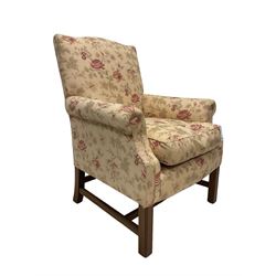 Peter Dudgeon - Georgian design mahogany framed armchair, shaped cresting rail over sprung back and seat flanked by rolled arms, upholstered in floral patterned fabric with matching seat cushion, on square supports joined by stretchers
Provenance: From the Estate of the late Dowager Lady St Oswald