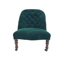 Small Victorian walnut framed nursing chair, spoon back upholstered in buttoned green fabric, on turned front supports, brass cups and castors