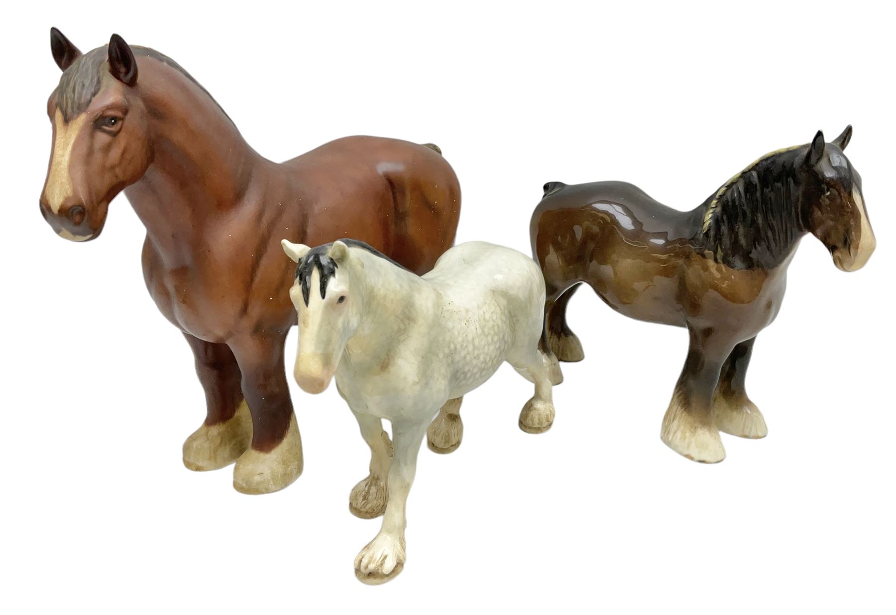 Group of three Beswick Shire horses, comprising CH. Burnham Beauty mare in matte finish, dapple grey horse and bay horse, all with stamped marks beneath