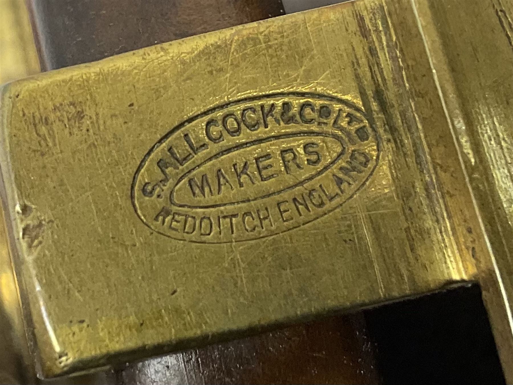 Three Allcocks & Co Ltd reels of brass and wood construction, the largest D4.5 inches