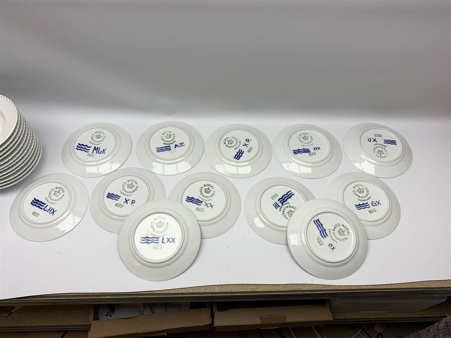 Royal Copenhagen tea and dinner service for twelve place settings, decorated in the Mega Blue Fluted pattern, pattern number 622, comprising dinner plates, salad plates, bowls with pierced rim, smaller bowls, tea cups, and saucers, dinner plates D27.5cm, salad plates D22cm