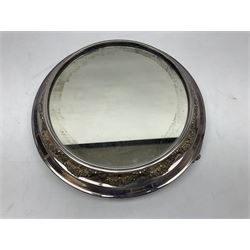 Elkington & Co silver plate plateau base, with central circular mirror set within bands of floral swags, makers stamp to base, raised upon three feet, D40cm