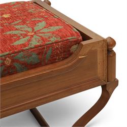 Traditional design teak long foot stool, red patterned seat cushion, on an X-frame base