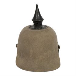 WWI Prussian 57th regiment Ersatz felt Pickelhaube, the grey felt skull with steel spike finial, stitched with green felt 57, chin strap, one side with a black cockade, the other black and red