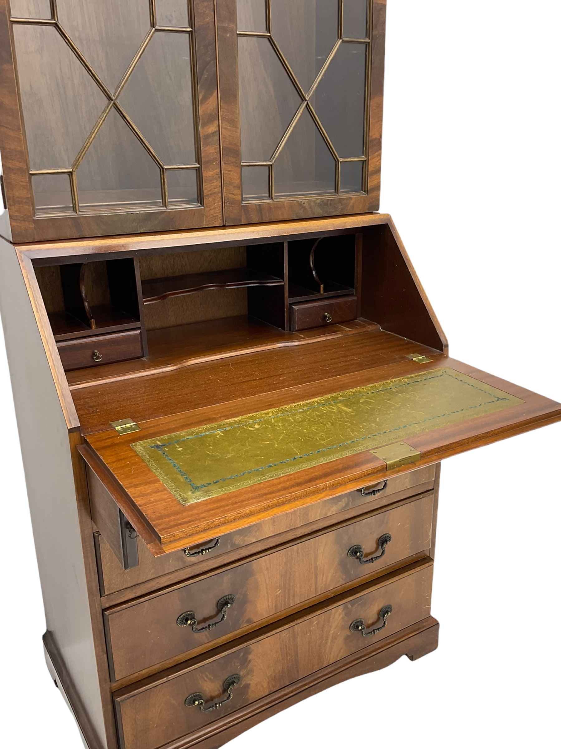 Reproduction mahogany bureau bookcase, the glazed bookcase over fall front bureau fitted with four drawers, on bracket feet