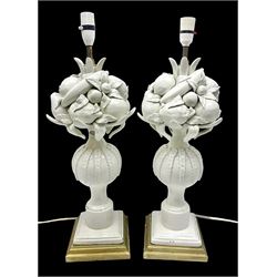 Pair of Casa Pupo white-glazed table lamps, modelled as a fruit upon a column of baluster form with foliate decoration, on a giltwood base, H62cm