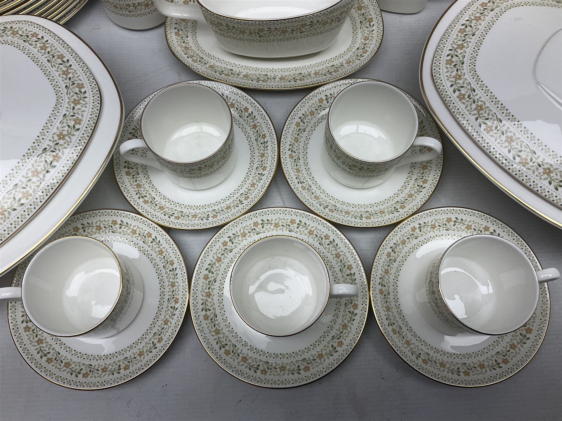 Royal Doulton Paisley pattern tea and dinner service for twelve, comprising dinner plates, side plates, soup bowls, dessert bowls, tea plates, two lidded tureens, sauce boat and saucer, sucrier and jug, oval serving dish and teacups and saucers