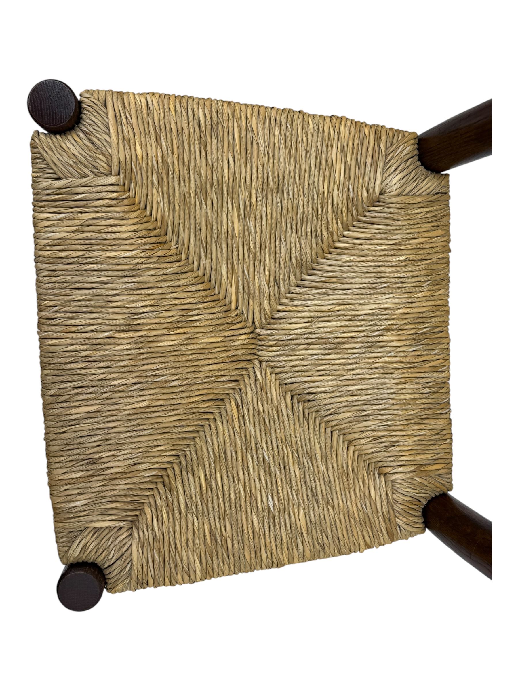 Set of ten 18th century design oak ladder back dining chairs, shaped cresting rail over four horizontal splats, rush seat raised on turned supports united by double stretchers